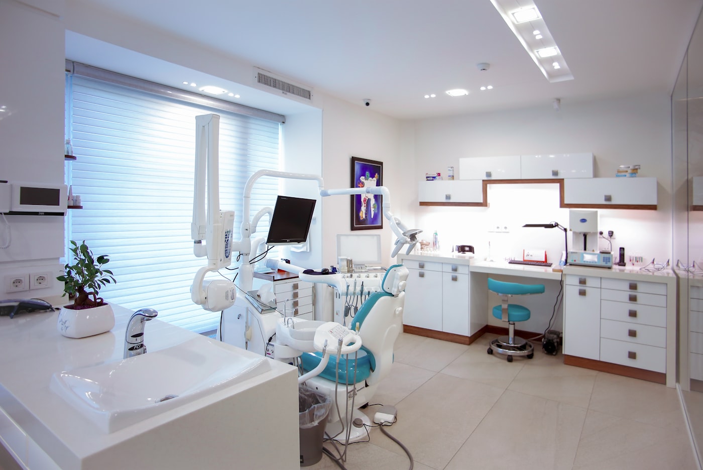 Clean medical clinic treatment room with calm clinical lighting